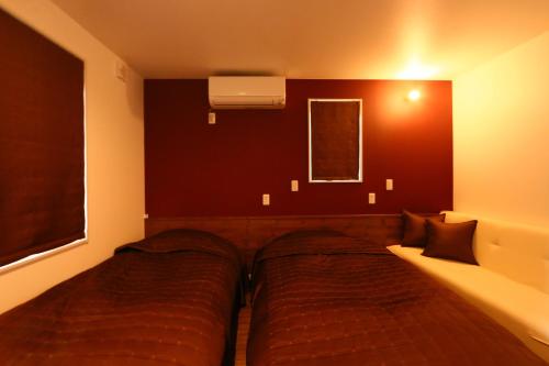 a bedroom with a large bed in a room at SILVER SPRAY MtFuji view Yamanakako in Yamanakako