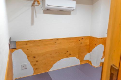 Postel nebo postele na pokoji v ubytování ゲストハウス高円寺純情ホテル -Guest House Koenji Junjo Hotel-