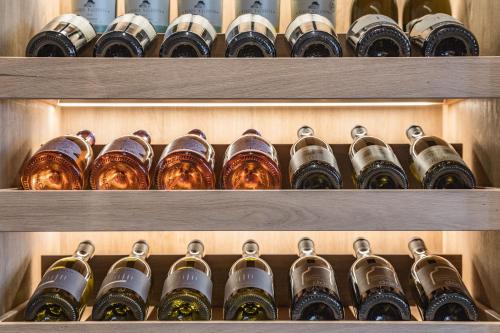 a bunch of bottles of wine in a cellar at Almhotel Glieshof in Malles Venosta