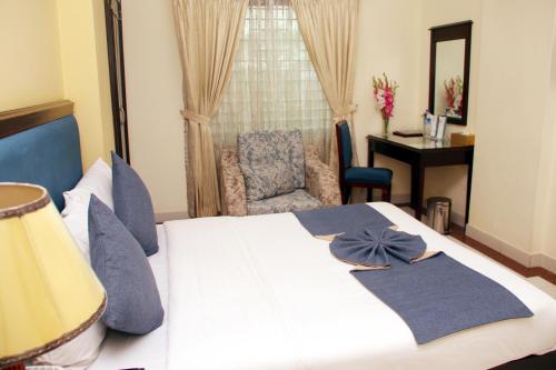 Una cama o camas en una habitación de Hotel Valley Garden - Sylhet