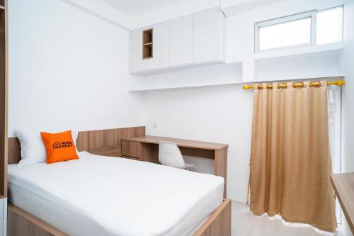 Postel nebo postele na pokoji v ubytování KoolKost near University of Indonesia 2 - Minimum Stay 2 Nights