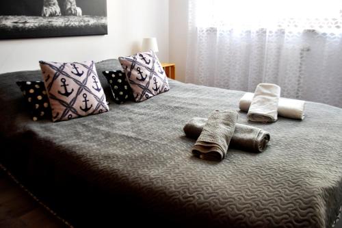 A bed or beds in a room at Apartament 1 Gdansk Bisko Plazy
