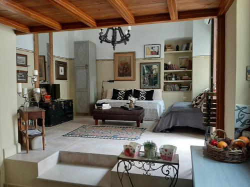 a living room with a bed and a table at Casa Callisti in Kalymnos