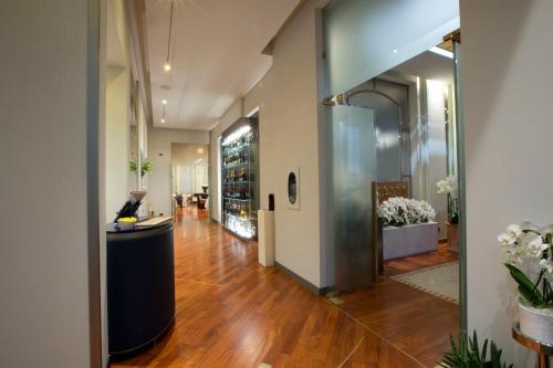 a hallway of a building with a reception desk at Palace Hotel Moderno in Pordenone