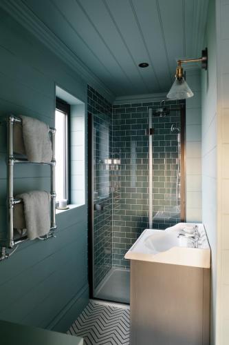 a bathroom with a sink and a shower at Retallack Resort by Away Resorts in Padstow