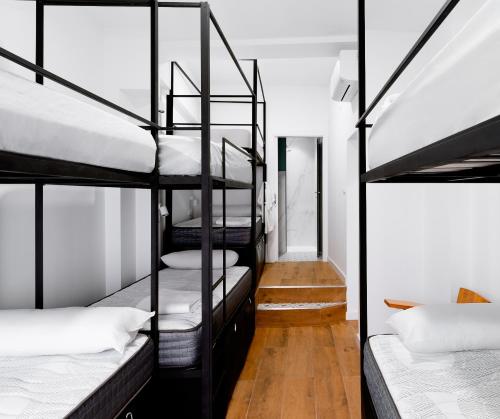 a room with a bunch of bunk beds at Housingleón - Albergue Turístico Nama Hostel in León