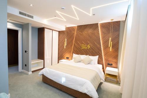 Säng eller sängar i ett rum på Hotel Pupin Novi Sad