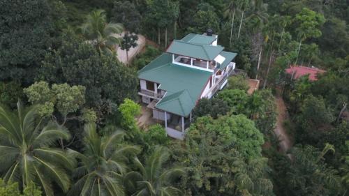 an aerial view of a house in the forest at Desire Village Rakwana in Rakwana