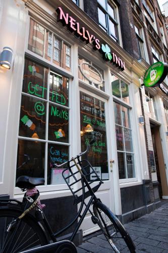 a bike parked in front of a nyayerskin store at Durty Nelly's Inn in Amsterdam