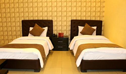 Hotel Akbar Internationalにあるベッド
