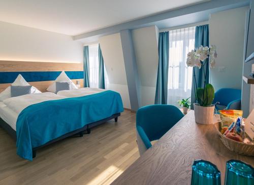 Postel nebo postele na pokoji v ubytování Hotel & Restaurant Hofmatt