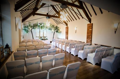 a room with rows of chairs in a building at Nuthurst Grange Country House Hotel & Restaurant in Solihull