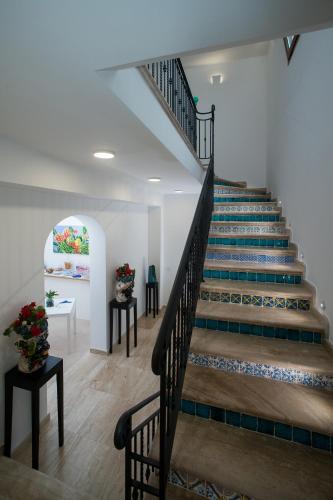 a staircase in a building with a stair case at COCCIU D’AMURI in Castellammare del Golfo