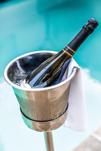 a whisk in a metal bucket on a table at Premier Hotel The Richards in Richards Bay