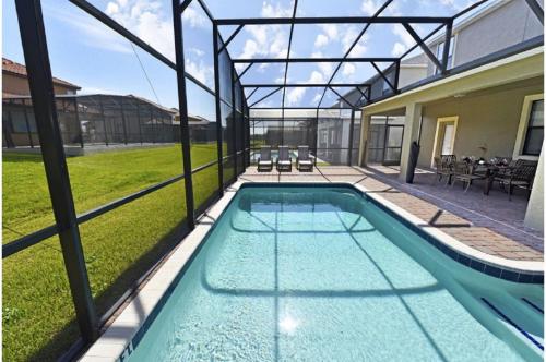 a swimming pool in the backyard of a house at Holiday Villas of Davenport in Davenport