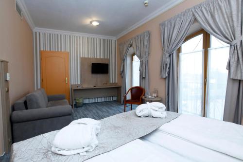 Ένα ή περισσότερα κρεβάτια σε δωμάτιο στο Wellness Hotel Laroba