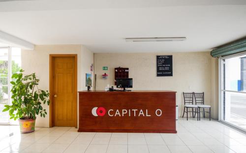 a waiting room with a captain o sign on the wall at Hotel San Pablo in Cholula