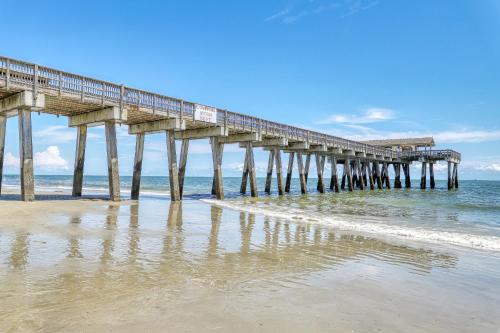 a pier on the beach near the ocean at Tybee Escape in Tybee Island
