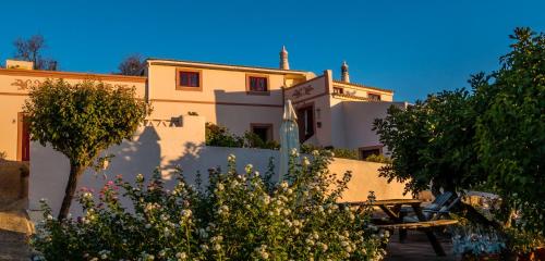 a building with trees in front of it at B&B Candelária in Loulé