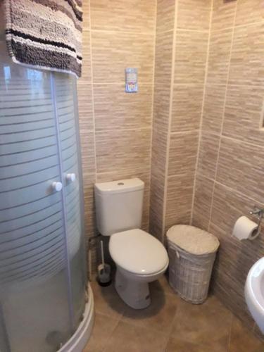 a bathroom with a toilet and a sink at Home from home Single or double room Netflix or Virgin TV Wifi & free parking in Poole