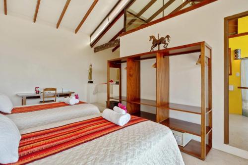 a bedroom with two beds in a room at Anamaya Resort in Montezuma