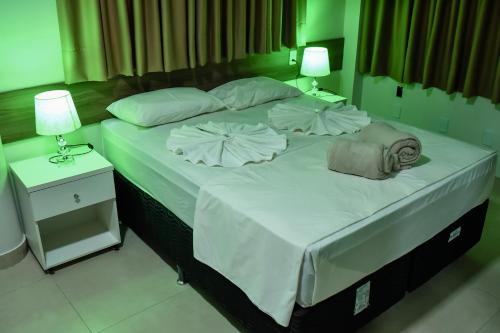 En eller flere senger på et rom på Tangará Hotel