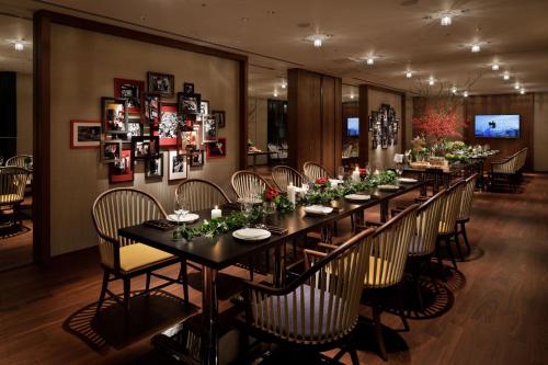 a long dining room with a long table and chairs at Hyatt Centric Ginza Tokyo in Tokyo