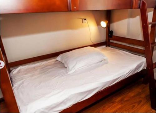 Posteľ alebo postele v izbe v ubytovaní Chengdu Meizhixing Hotel