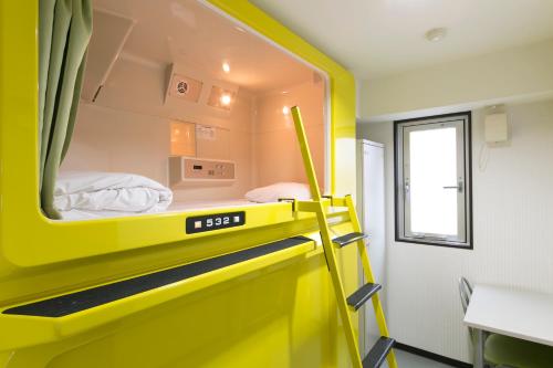 Ένα ή περισσότερα κρεβάτια σε δωμάτιο στο Hotel Shin-Imamiya