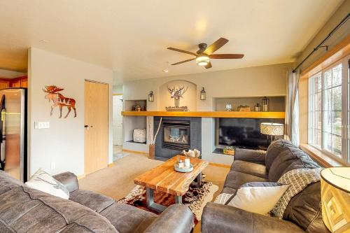 a living room with a couch and a fireplace at Skiscape in Steamboat Springs