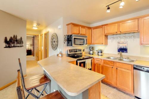 a kitchen with wooden cabinets and a counter top at Skiscape in Steamboat Springs
