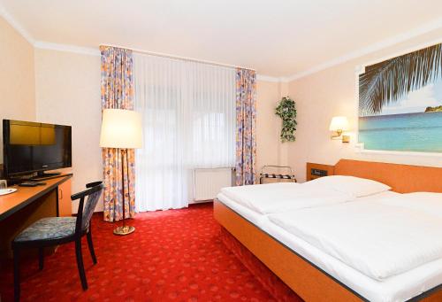 Ένα ή περισσότερα κρεβάτια σε δωμάτιο στο Landgasthof & Hotel Waldow