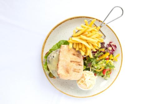 a plate of food with a salad and pasta at Imperial Hotel in Llandudno