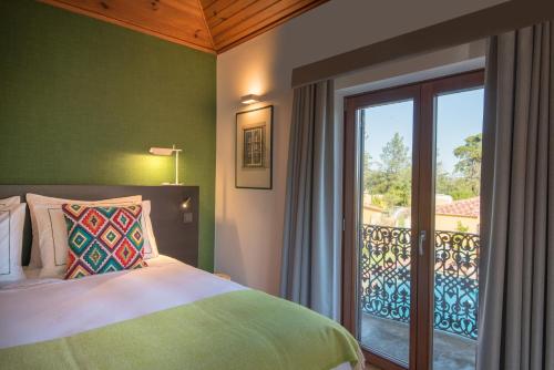 Säng eller sängar i ett rum på Quinta das Pedras