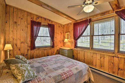 a bedroom with a bed and a ceiling fan at Springwater Cabin Near Hiking, Lakes, and Vineyards in Springwater