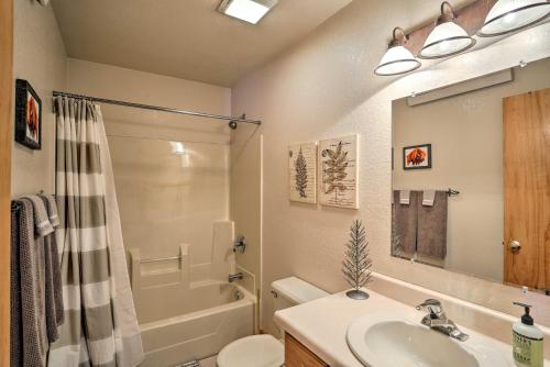 a bathroom with a sink and a shower and a toilet at Black Hills Cabin about 2 Mi to Terry Peak! in Lead