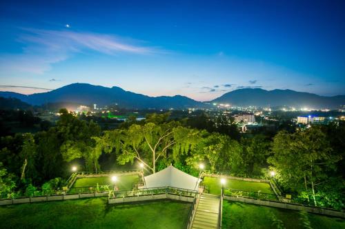 a view of a park at night with lights at Studio apartments on a hill in Kathu