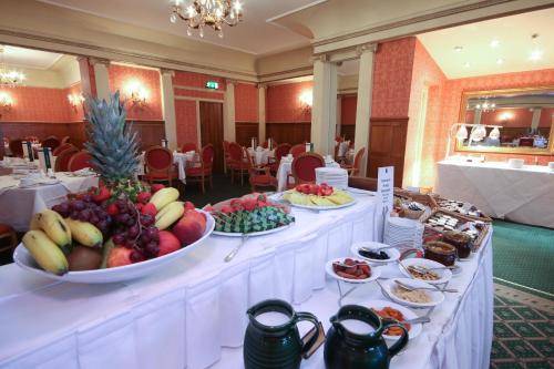 a buffet line with bowls of fruit on display at Imperial Hotel in Llandudno