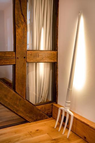 a white object is standing in front of a window at Hotel Brunnenhaus Schloss Landau in Bad Arolsen