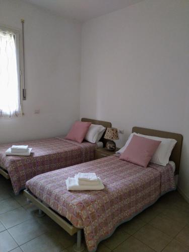 Cama o camas de una habitación en Hotel Il Timone