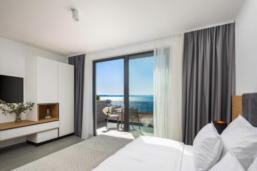 Postel nebo postele na pokoji v ubytování Fontevita Apartments