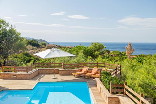 a villa with a pool and a view of the ocean at Costa Paradiso Resort in Costa Paradiso