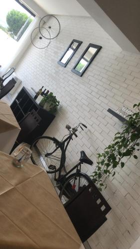 a bike parked in a room with windows at Hotel Royal in San Benedetto del Tronto