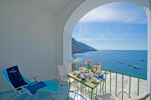 a balcony with a view of the ocean at Palazzo Talamo in Positano