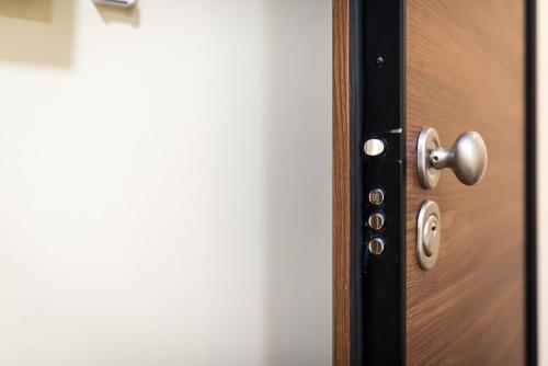 a close up of a wooden door with a knob at SLATKI SNOVI II in Knin