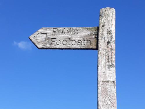 a wooden cross with the words puerto religiosity at High Greenside in Kirkby Stephen