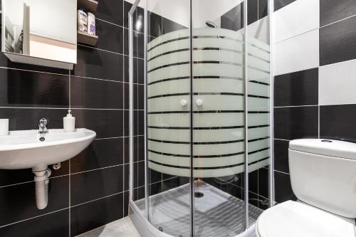 a bathroom with a toilet and a sink at Guest house Slatki Snovi in Knin