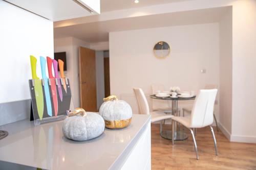 two pumpkins sitting on a counter in a room at Sunshine Place in Enfield