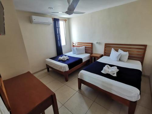Katil atau katil-katil dalam bilik di Progreso Beach Hotel