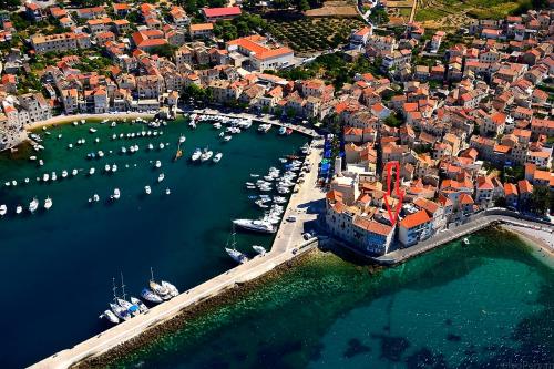 an aerial view of a harbor with boats in the water at Villa Kuljis in Komiža